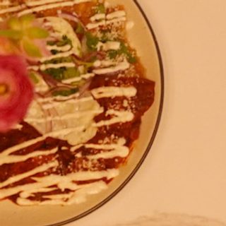 Chilaquiles chipotle topped with crema and cotija